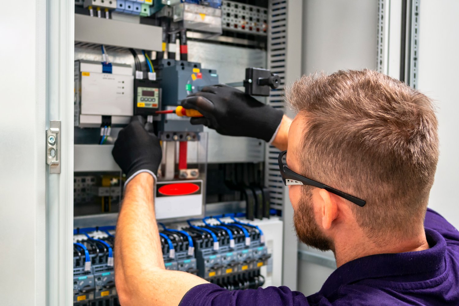 Guy installing technical equipment